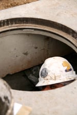 Hacker in manhole